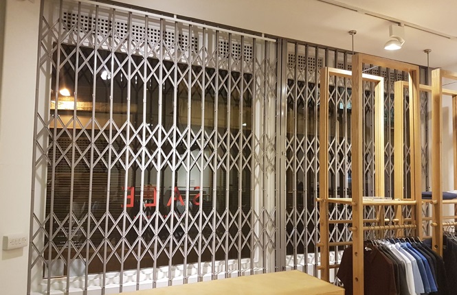 RSG1000 security grilles securing a clothing shop in Redchurch St, Central London.