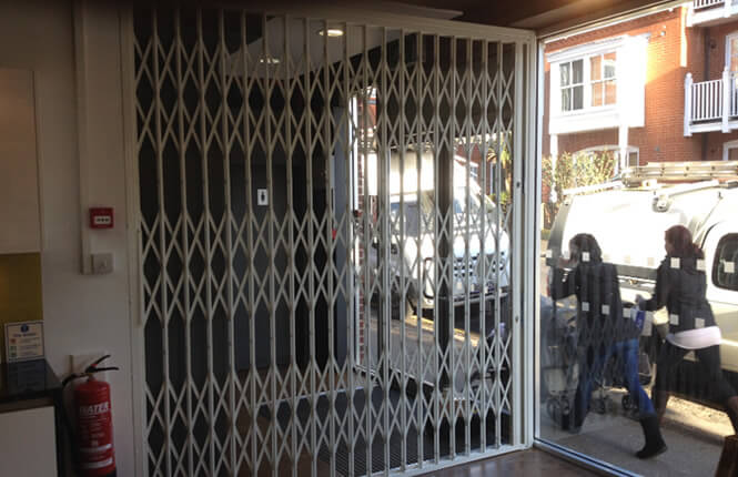 RSG1000 retractable security grille securing shop front in London West-End.