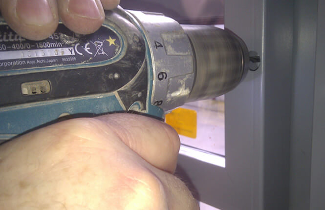 RSG2400 window screen being fitted for theft protection.