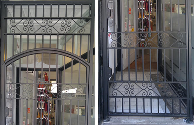 RSG3000 wrought iron gate and overhead panel with scrolls on shop entrance in London city.