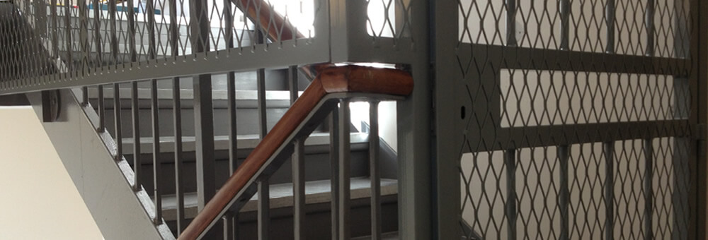 RSG3000 security door gate and mesh barrier installed on communal fire staircase in Camden