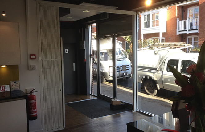 RSG1000 retractable security grille, opened during working hours in London.