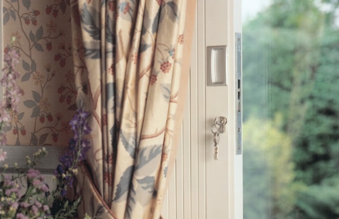 RSG11400 folding security grilles, protecting home office window in Mitcham.