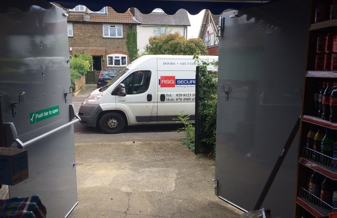 RSG8100 heavy duty fabricated fire exit doorset securing a shop storage unit in Surrey.