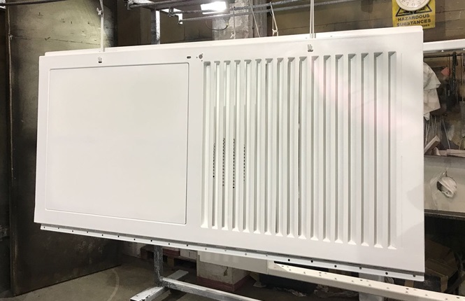 RSG8200 heavy duty fabricated louvred leaf and a half doorset with overhead panel powder coated white.